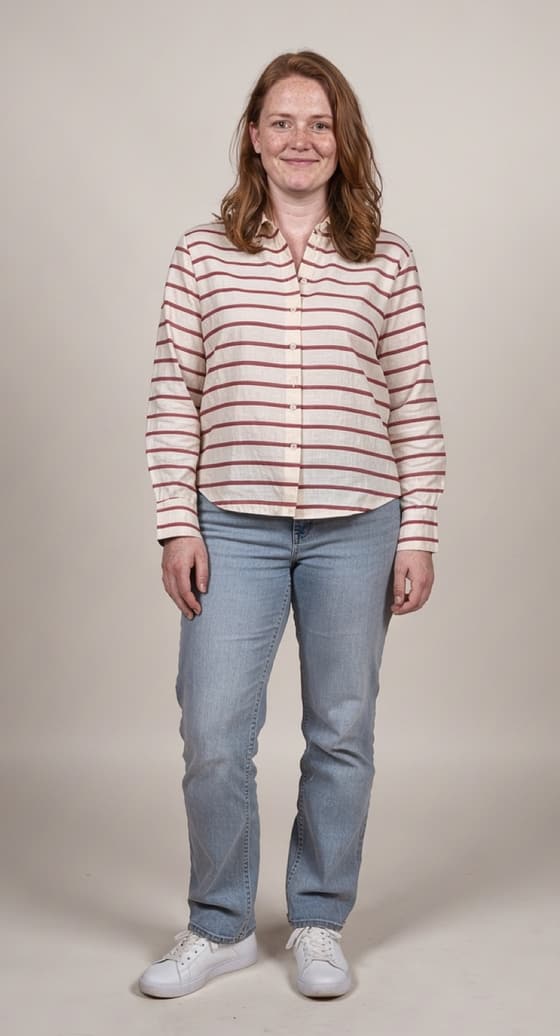 Wearing the striped shirt: the same photo, now in a red striped shirt; her jeans, face and pose unchanged.